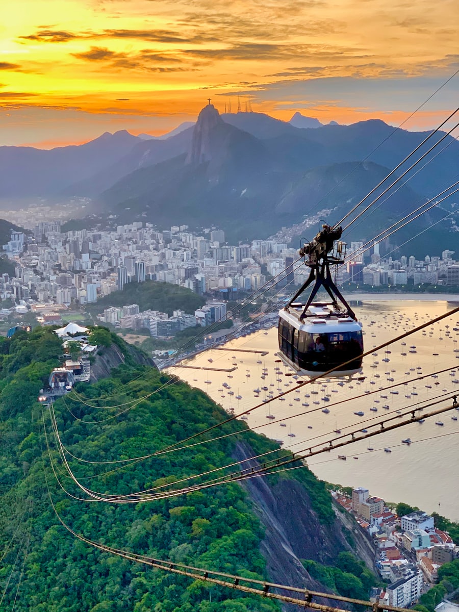 Sugarloaf cable car at sunset, with Christ the Redeemer in the distance